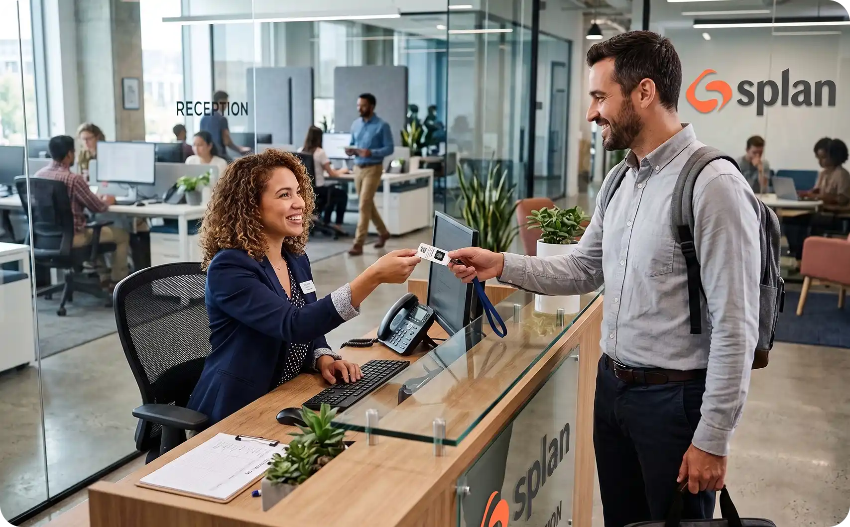 Splan reception desk employee receiving a new access badge during a rebadging campaign